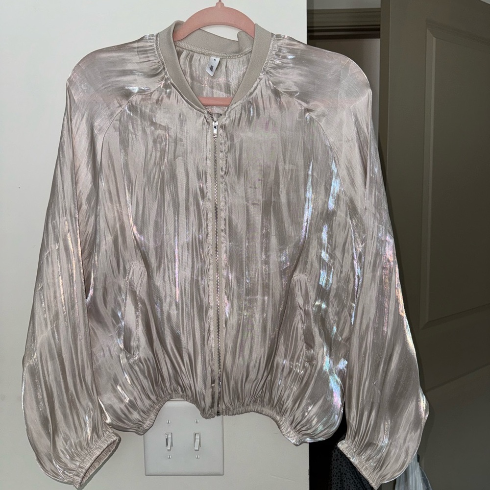 This is a slightly sheer jacket that I can best describe as a pearlescent color